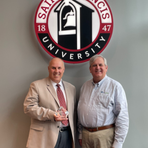 Dr. Pete Skoner accepts PA Cyber Polytechnic Academy, Partner of the Year Award for Higher Education 