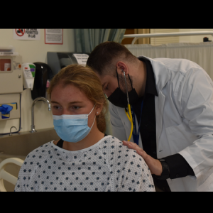  nursing student taking vitals of mock patient