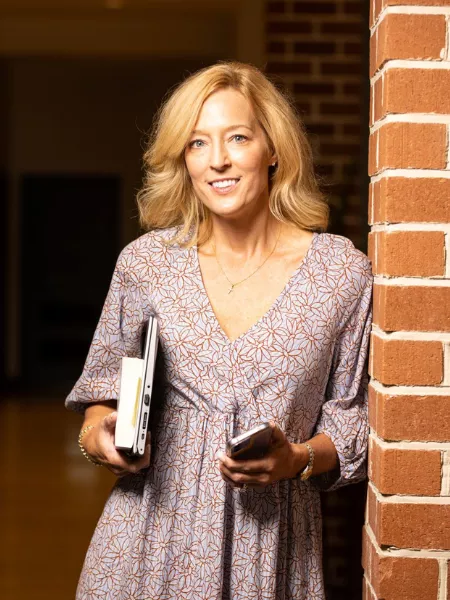 adult student holding books