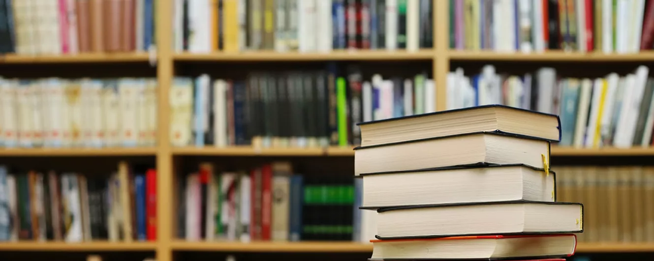 Inside college library books stacked 